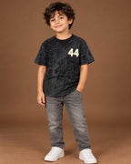 Black Kids’ 44 Washed Graphic T-Shirt, child model front three-quarter view. T-shirt only.