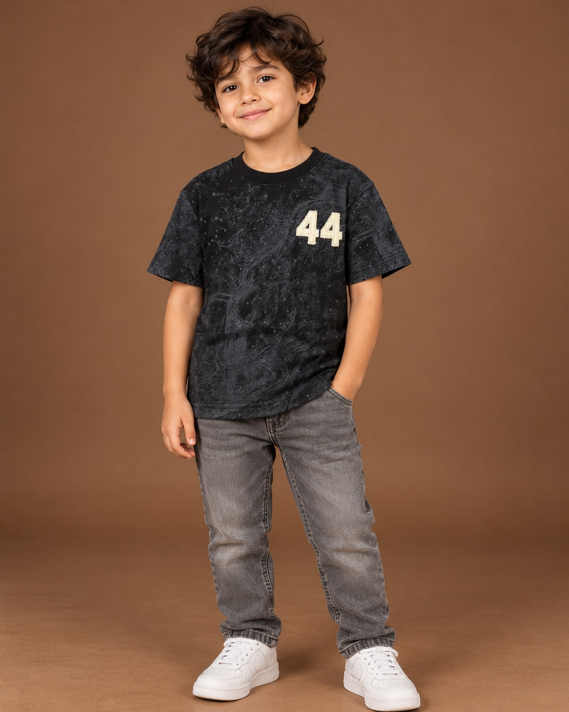 Black Kids’ 44 Washed Graphic T-Shirt, child model front three-quarter view. T-shirt only.