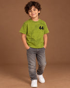 Lime Kids’ 44 Washed Graphic T-Shirt, child model front three-quarter view. T-shirt only.