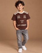 Brown Kids’ City Current Seven T-Shirt, child model front three-quarter view. T-shirt only.