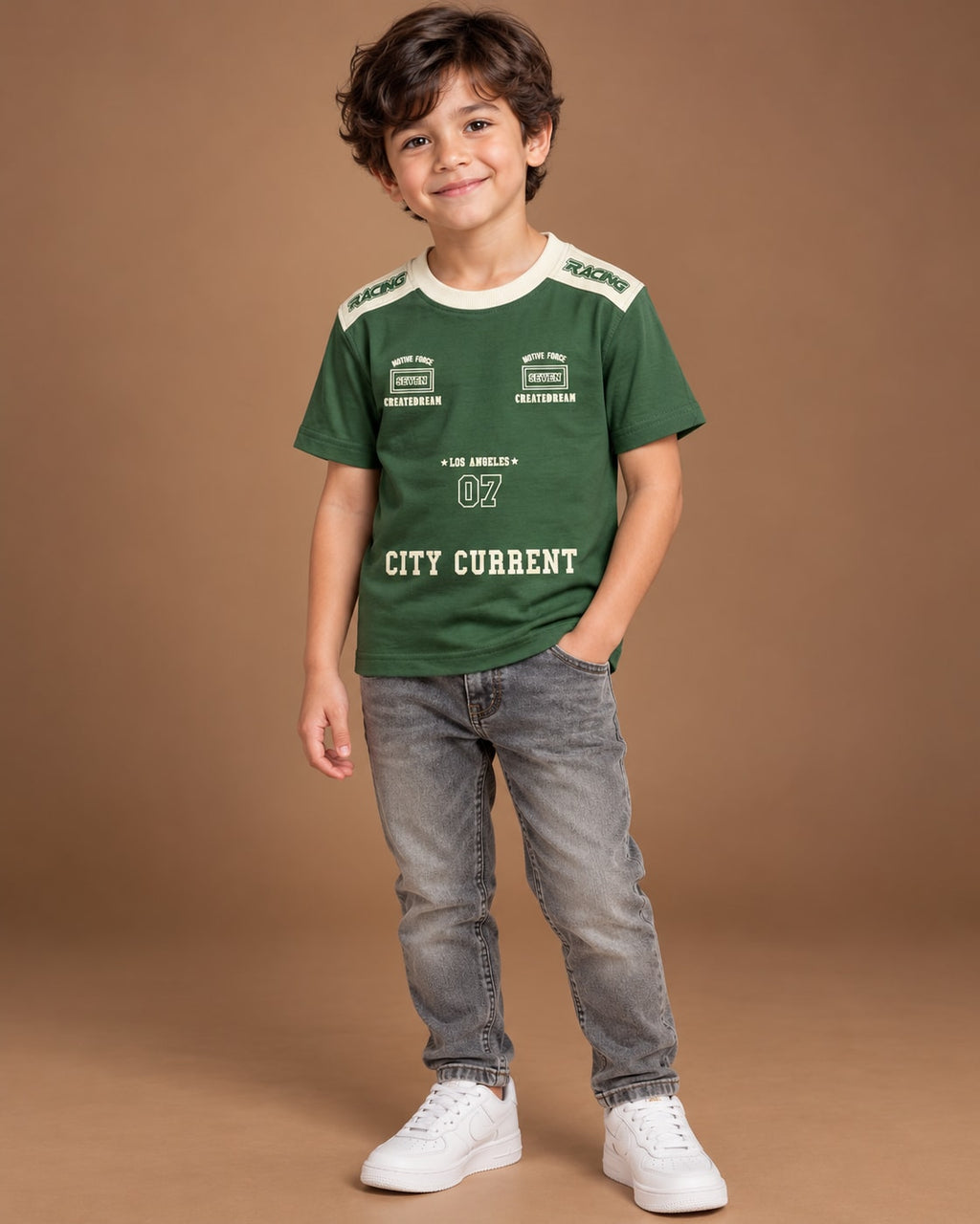 Green Kids’ City Current Seven T-Shirt, child model front three-quarter view. T-shirt only.