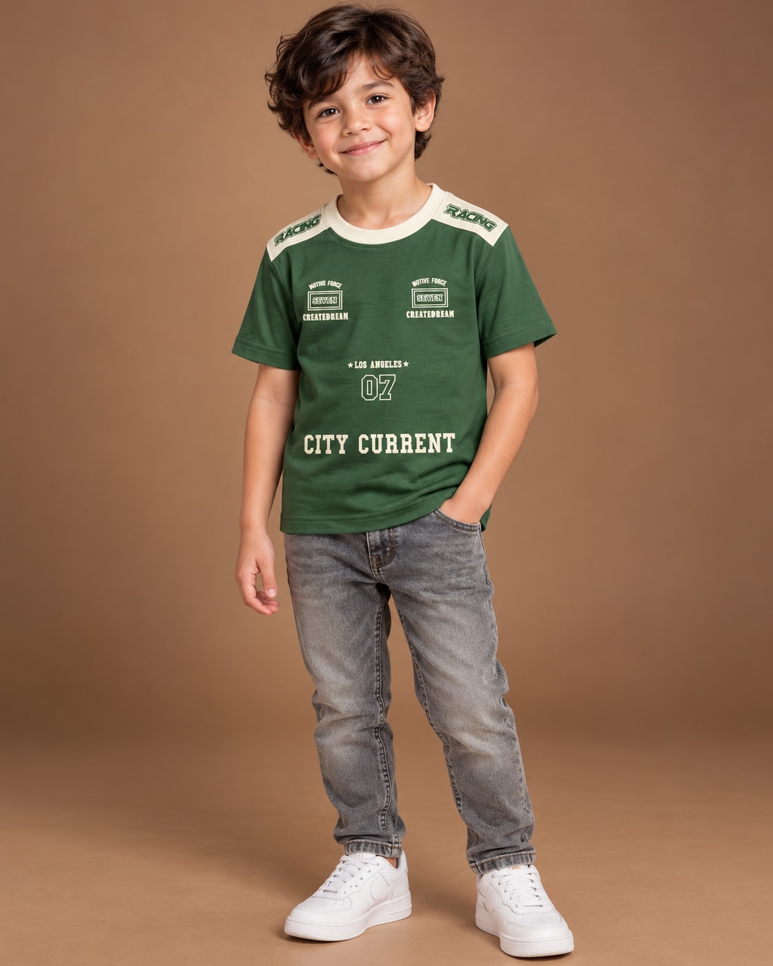 Green Kids’ City Current Seven T-Shirt, child model front three-quarter view. T-shirt only.