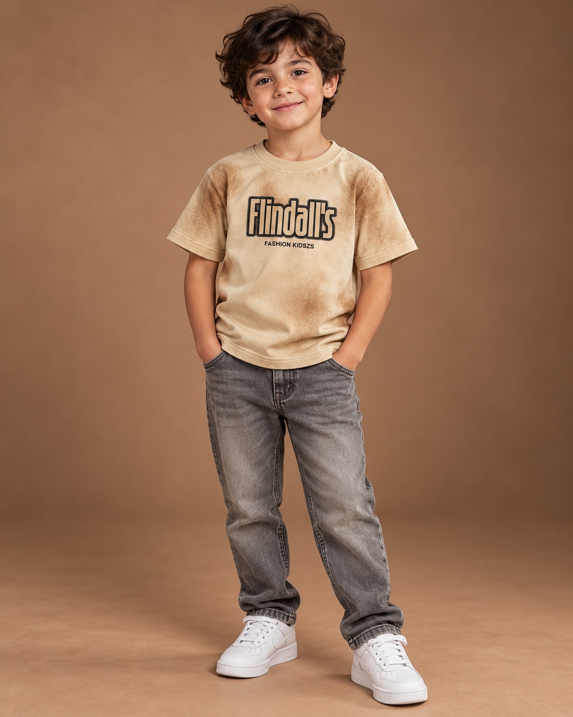 Sand Kids’ Flindall’s Star Graphic T-Shirt, child model front three-quarter view. T-shirt only.