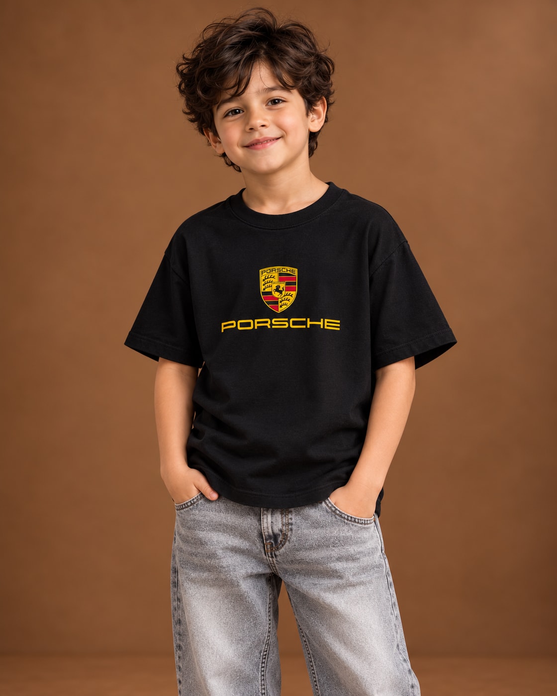 Black Kids’ Motorsport Studio Graphic T-Shirt, child model front three-quarter view. T-shirt only.