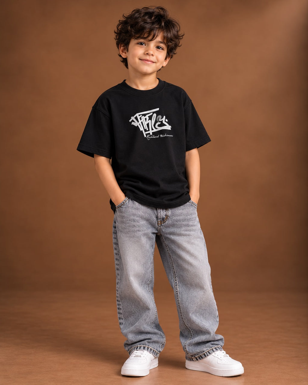 Black Kids’ Richley Graffiti T-Shirt, child model front three-quarter view. T-shirt only.
