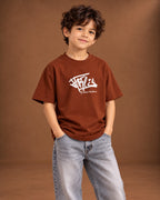Brown Kids’ Richley Graffiti T-Shirt, child model front three-quarter view. T-shirt only.
