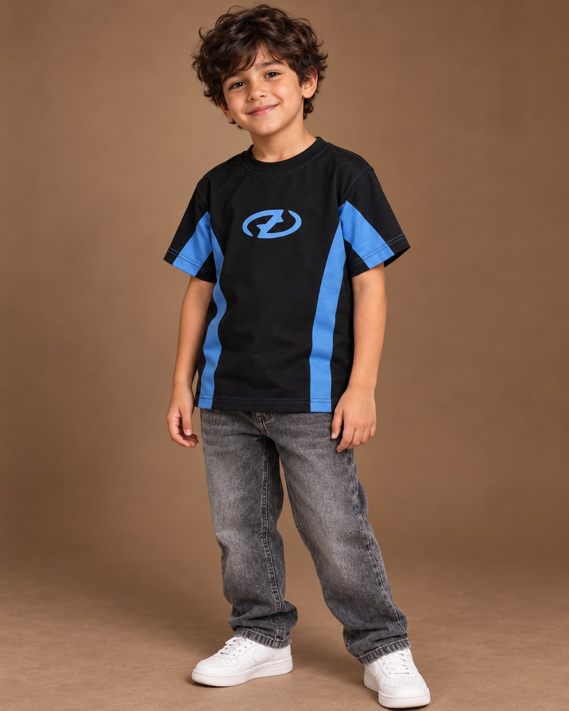 Black / Blue Kids’ Unloose Colourblock T-Shirt, child model front three-quarter view. T-shirt only.