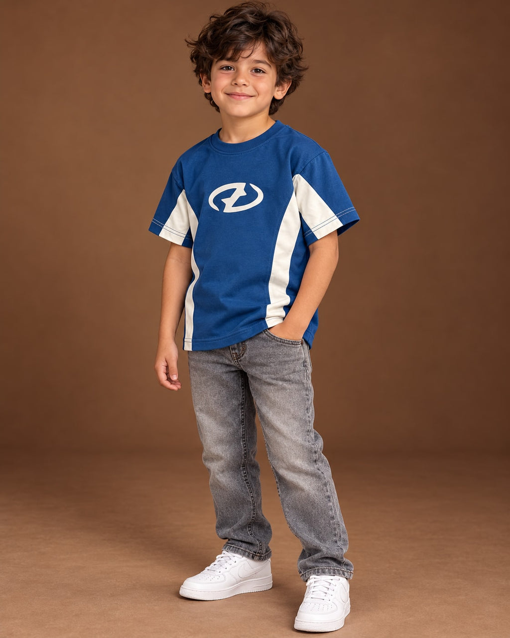 Blue / Cream Kids’ Unloose Colourblock T-Shirt, child model front three-quarter view. T-shirt only.