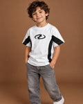 White / Black Kids’ Unloose Colourblock T-Shirt, child model front three-quarter view. T-shirt only.