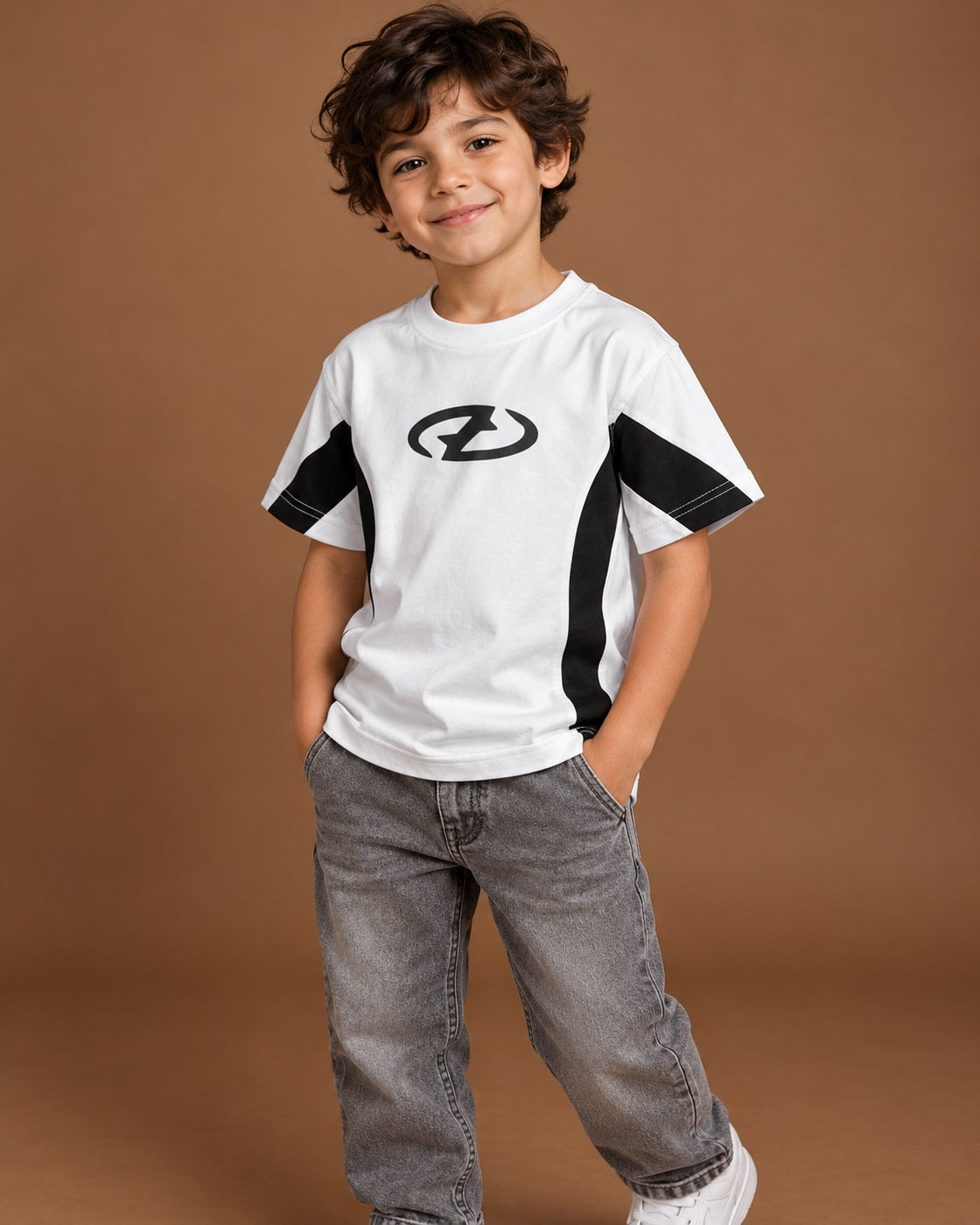 White / Black Kids’ Unloose Colourblock T-Shirt, child model front three-quarter view. T-shirt only.