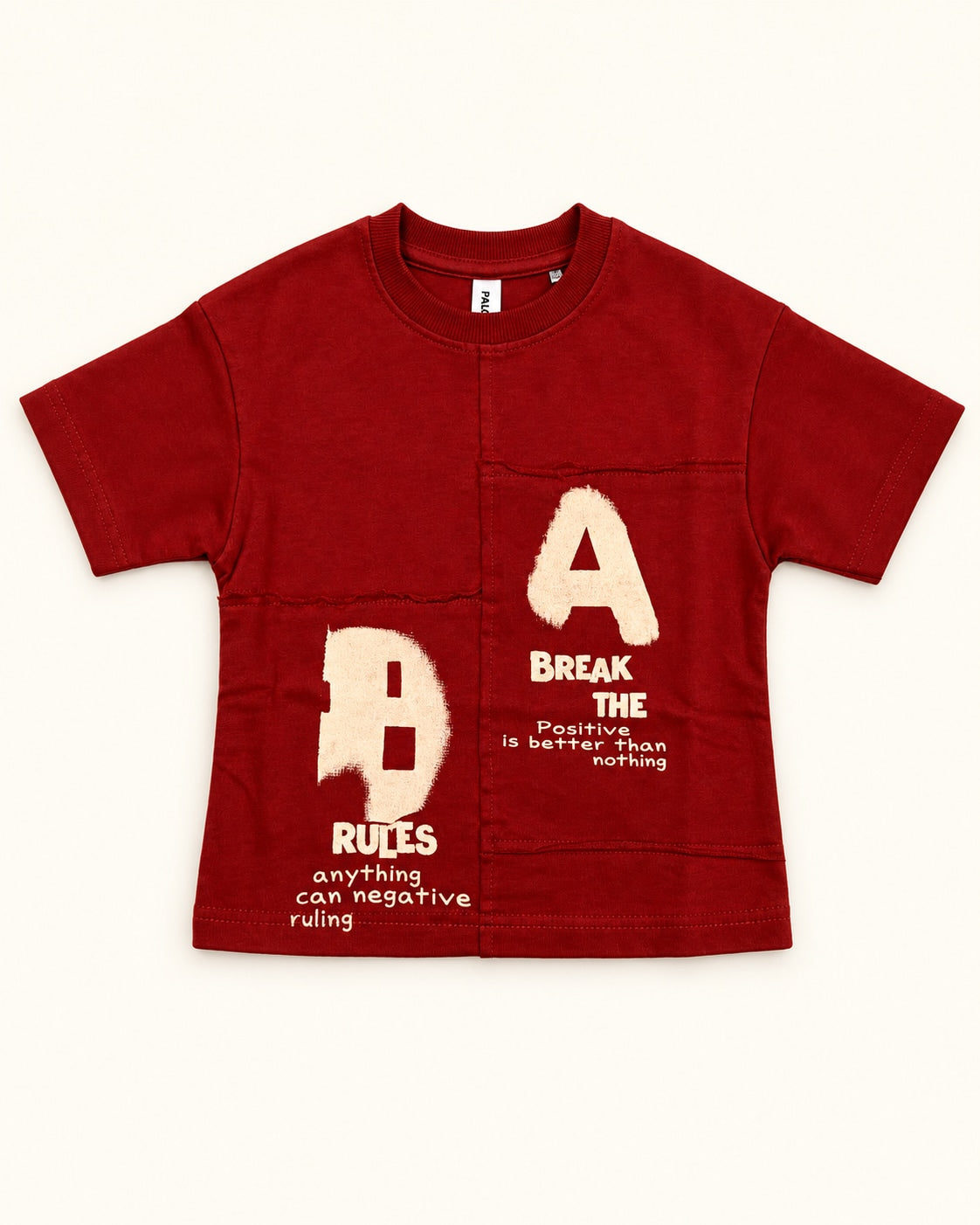Front view of red kids’ a/b graphic t-shirt.