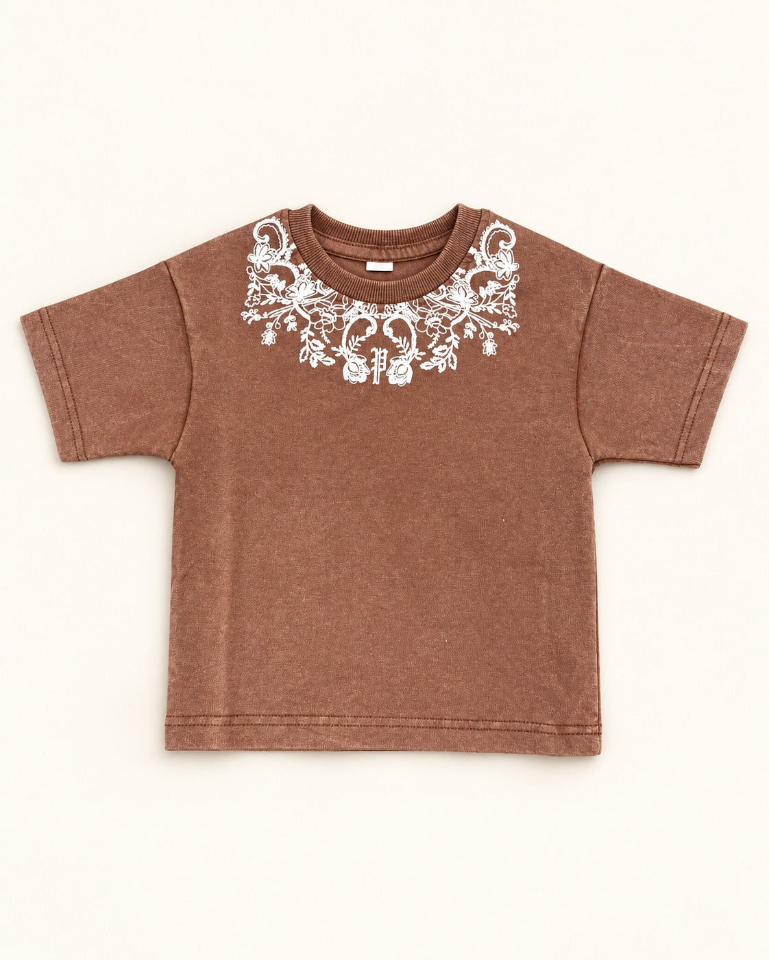 Front view of brown kids’ ornamental print t-shirt.