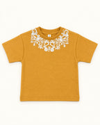Front view of mustard kids’ ornamental print t-shirt.